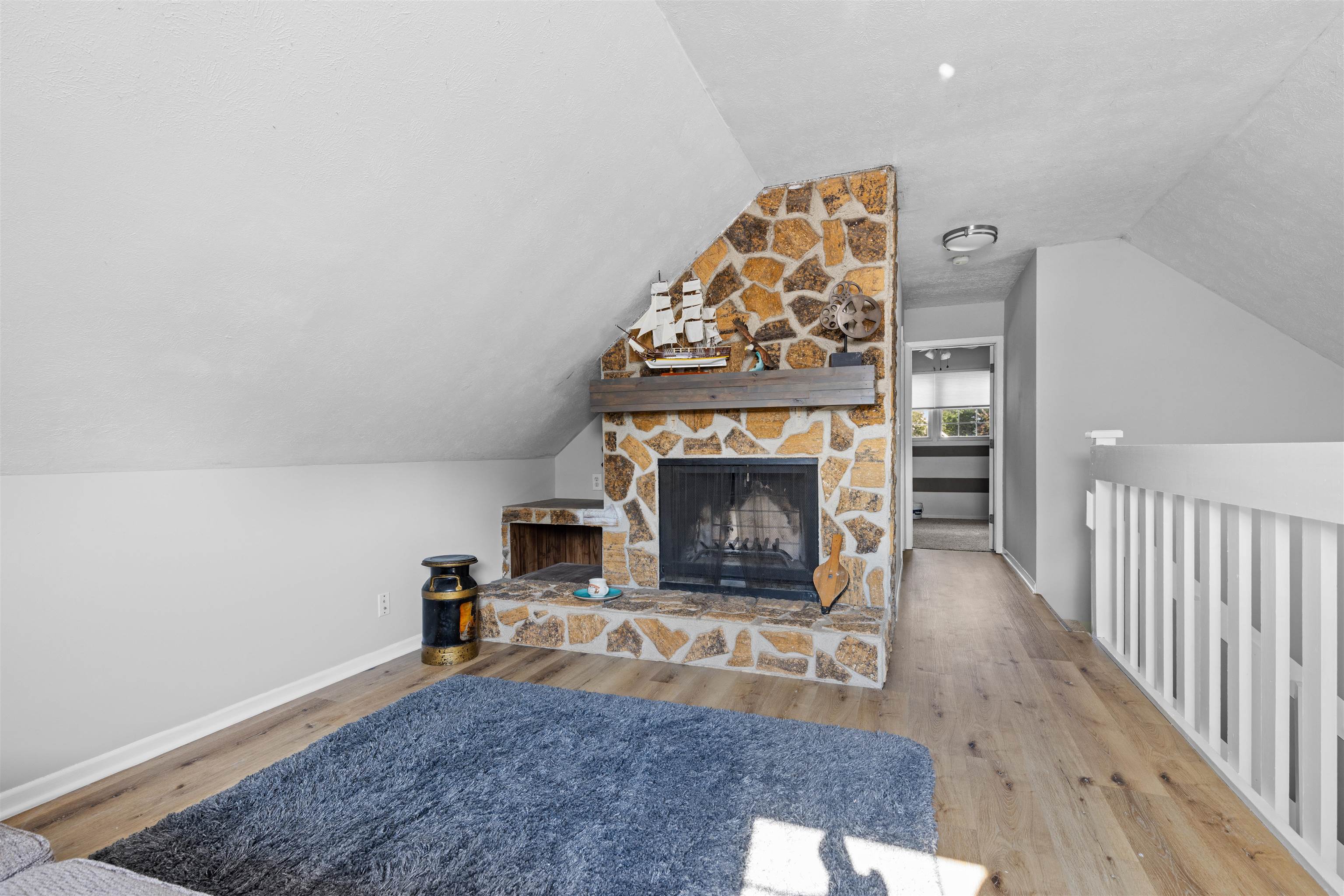 4830 Crown Point Circle Roscoe, IL 61073 - Photo 10 of 24 a living room with furniture and a fireplace