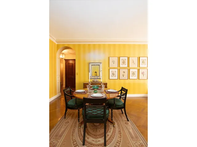a view of a dining room with furniture and a window