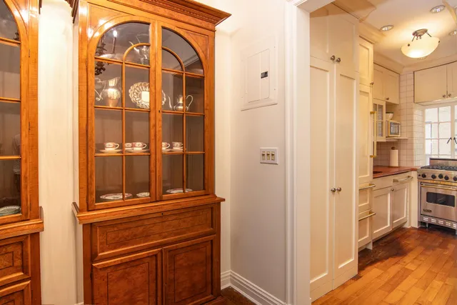 a dining room with furniture and chandelier