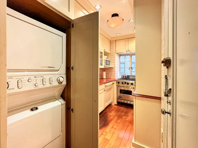 a view of a bathroom with a sink a bath tub and shower