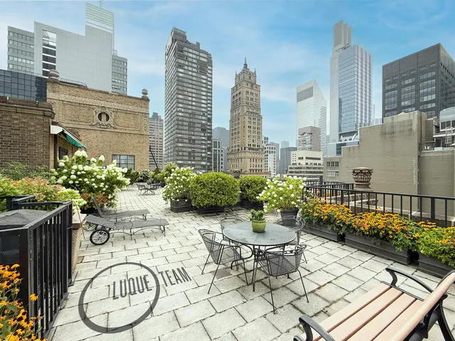 a bathroom with a granite countertop bathtub and shower