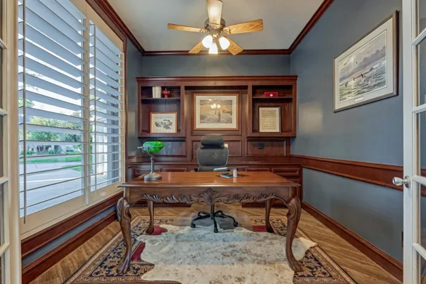 a workspace with furniture and a chandelier