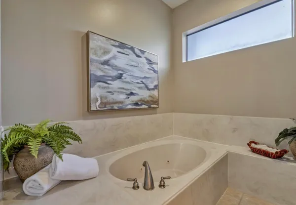 a white bath tub sitting in a bathroom