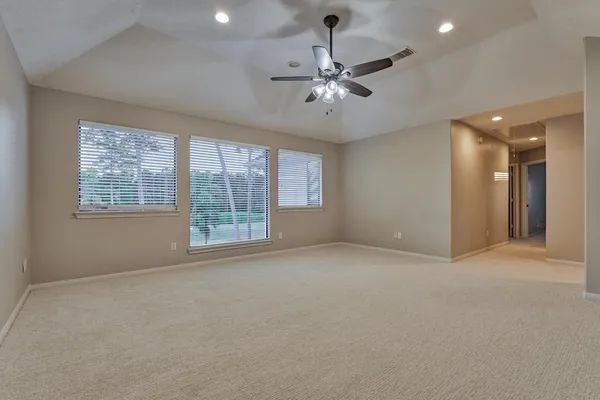 a view of an empty room with a window