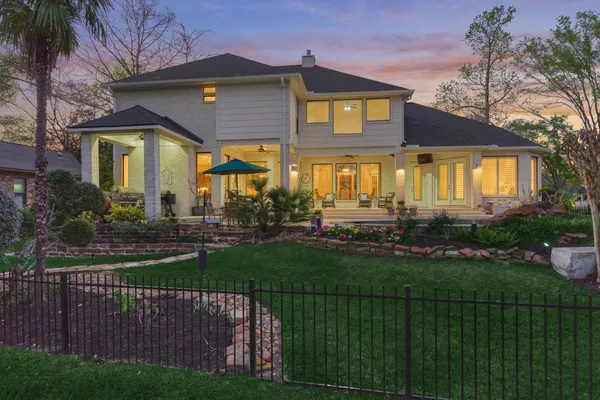 a front view of a house with a yard table and chairs