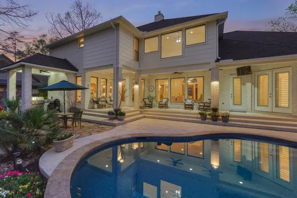 a view of a house with pool porch and furniture