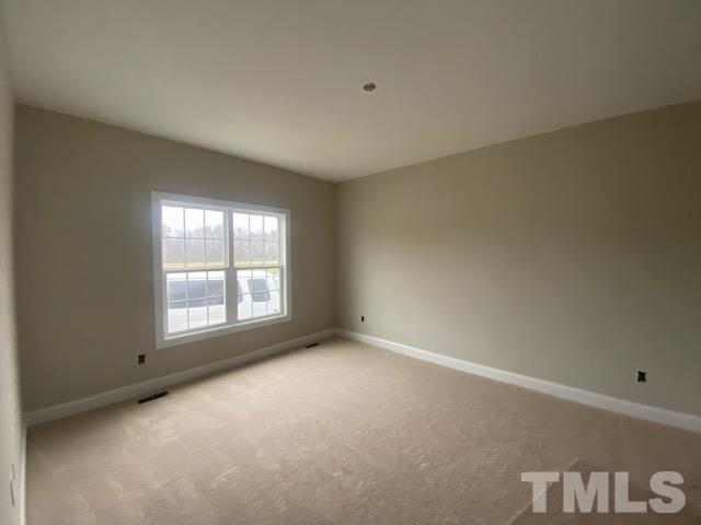 2927 Hobson Road Dunn, NC 28334 - Photo 4 of 12 an empty room with a window