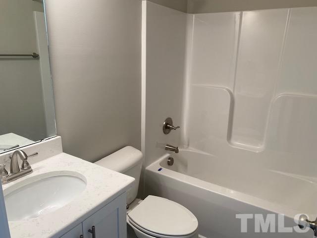 2927 Hobson Road Dunn, NC 28334 - Photo 6 of 12 a bathroom with a sink toilet and bathtub