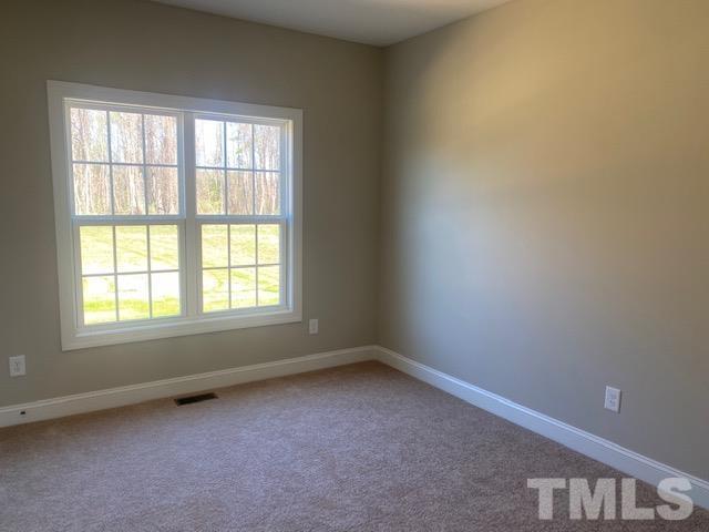 2927 Hobson Road Dunn, NC 28334 - Photo 7 of 12 an empty room with a window