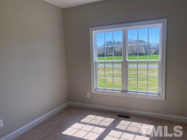 2927 Hobson Road Dunn, NC 28334 - Photo 10 of 12 an empty room with a window