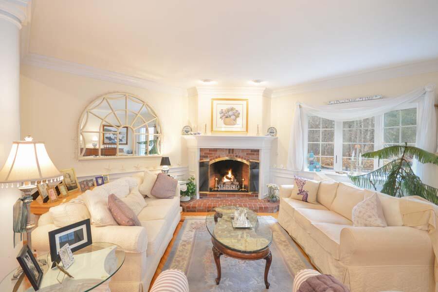 80 Farm Valley Road Osterville, MA 02655 - Photo 15 of 47 a living room with furniture a fireplace and a large window