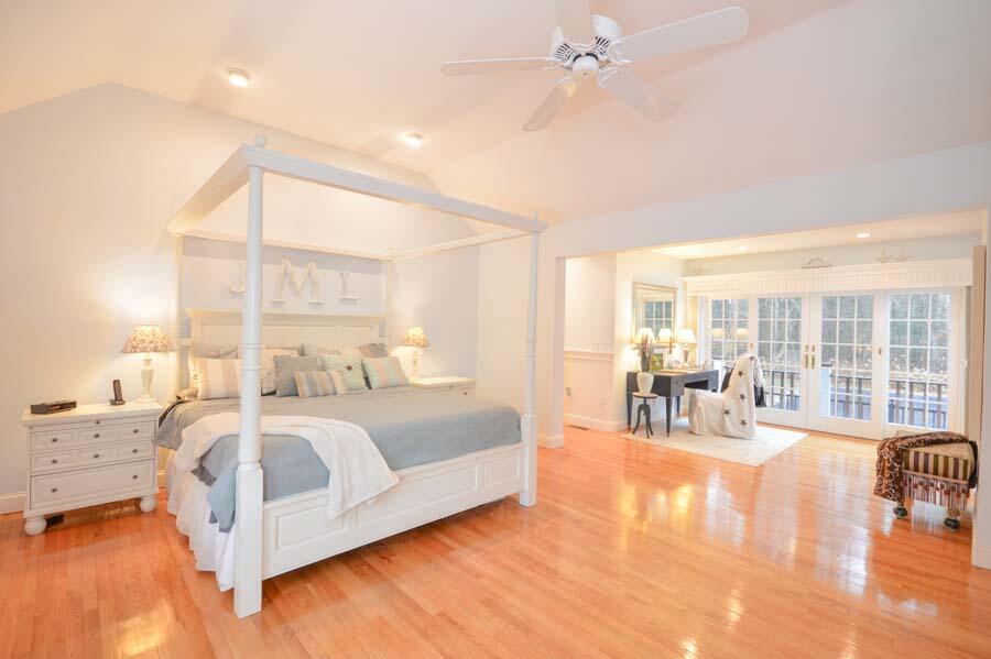 80 Farm Valley Road Osterville, MA 02655 - Photo 20 of 47 a spacious bedroom with a bed and a table