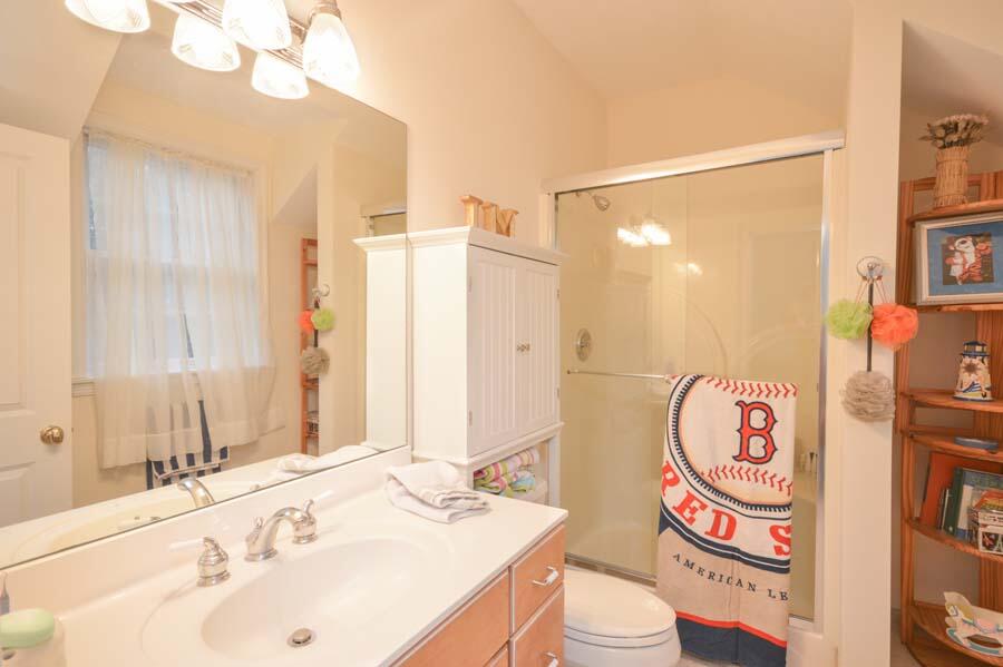 80 Farm Valley Road Osterville, MA 02655 - Photo 32 of 47 a bathroom with a sink a toilet and a shower curtain