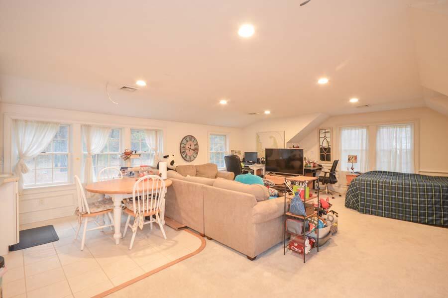 80 Farm Valley Road Osterville, MA 02655 - Photo 33 of 47 a living room with lots of furniture and a large window
