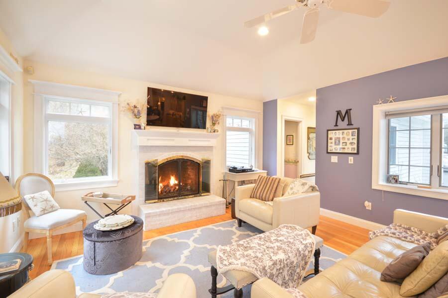 80 Farm Valley Road Osterville, MA 02655 - Photo 8 of 47 a living room with furniture and a fireplace
