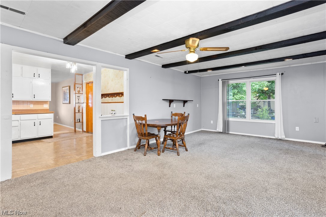 387 Fairfax Road Vermilion, OH 44089 - Photo 16 of 35 Dining room with beamed ceiling, light parquet floors, and ceiling fan