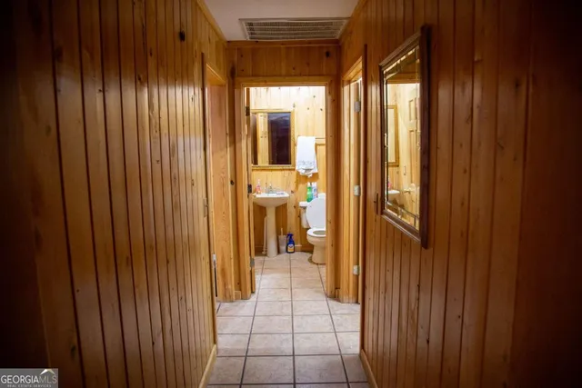 a view of a bathroom with mirror