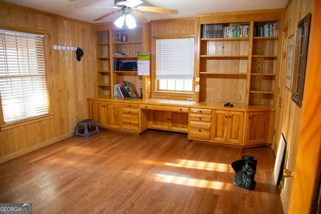 a view of a livingroom with furniture and staircase