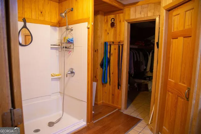 a bathroom with a glass shower door