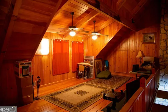 a living room with furniture a air conditioner vent and a window
