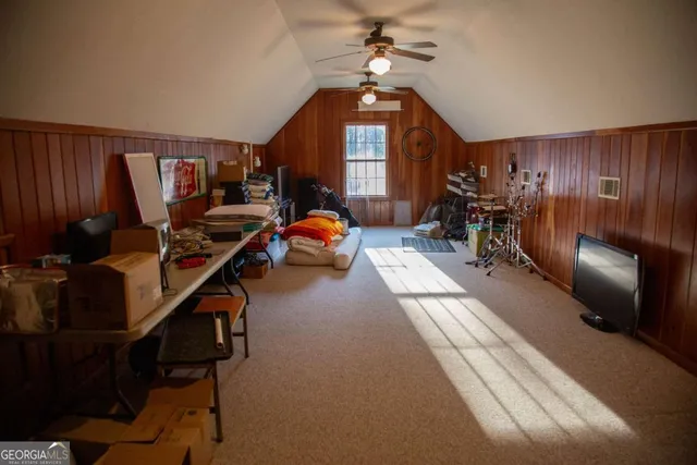 a view of a hallway with stairs