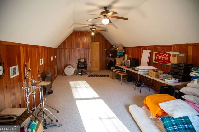 a view of porch with two chairs and a large window