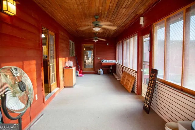a lobby with furniture and large windows