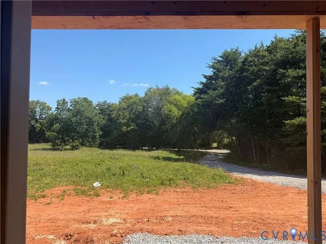 a kitchen with stainless steel appliances granite countertop a sink a stove a refrigerator and a refrigerator