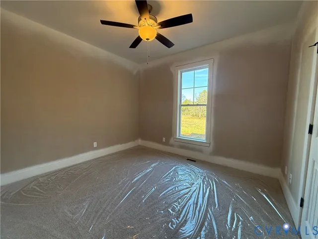 a spacious bathroom with a granite countertop sink a mirror and a shower