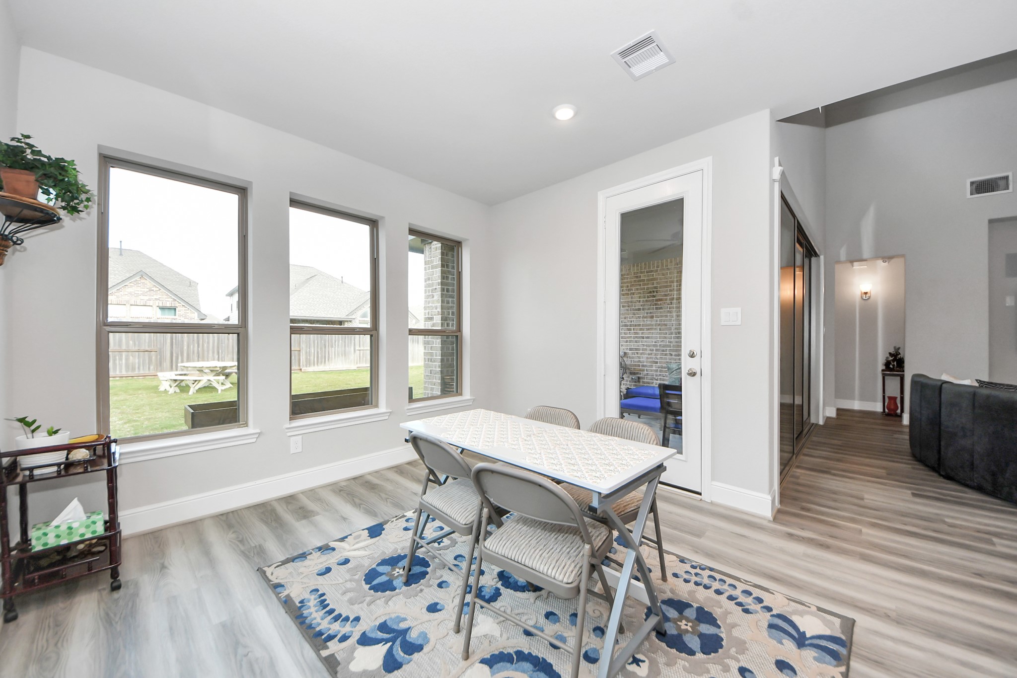 10514 Rigel Rdg Way Richmond, TX 77406 - Photo 14 of 50 a living room with furniture and a wooden floor