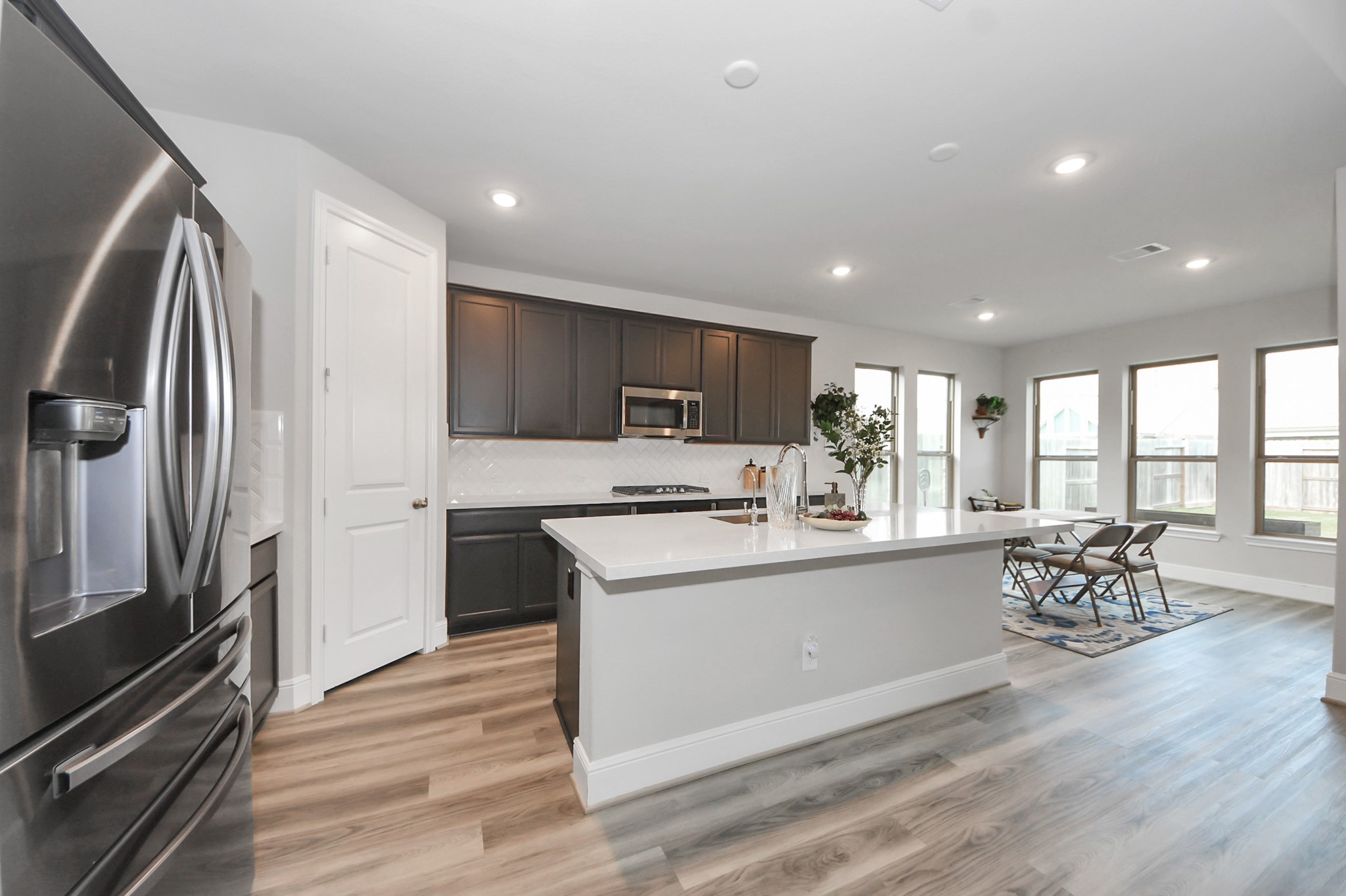 10514 Rigel Rdg Way Richmond, TX 77406 - Photo 17 of 50 a kitchen with stainless steel appliances granite countertop a refrigerator stove top oven and sink