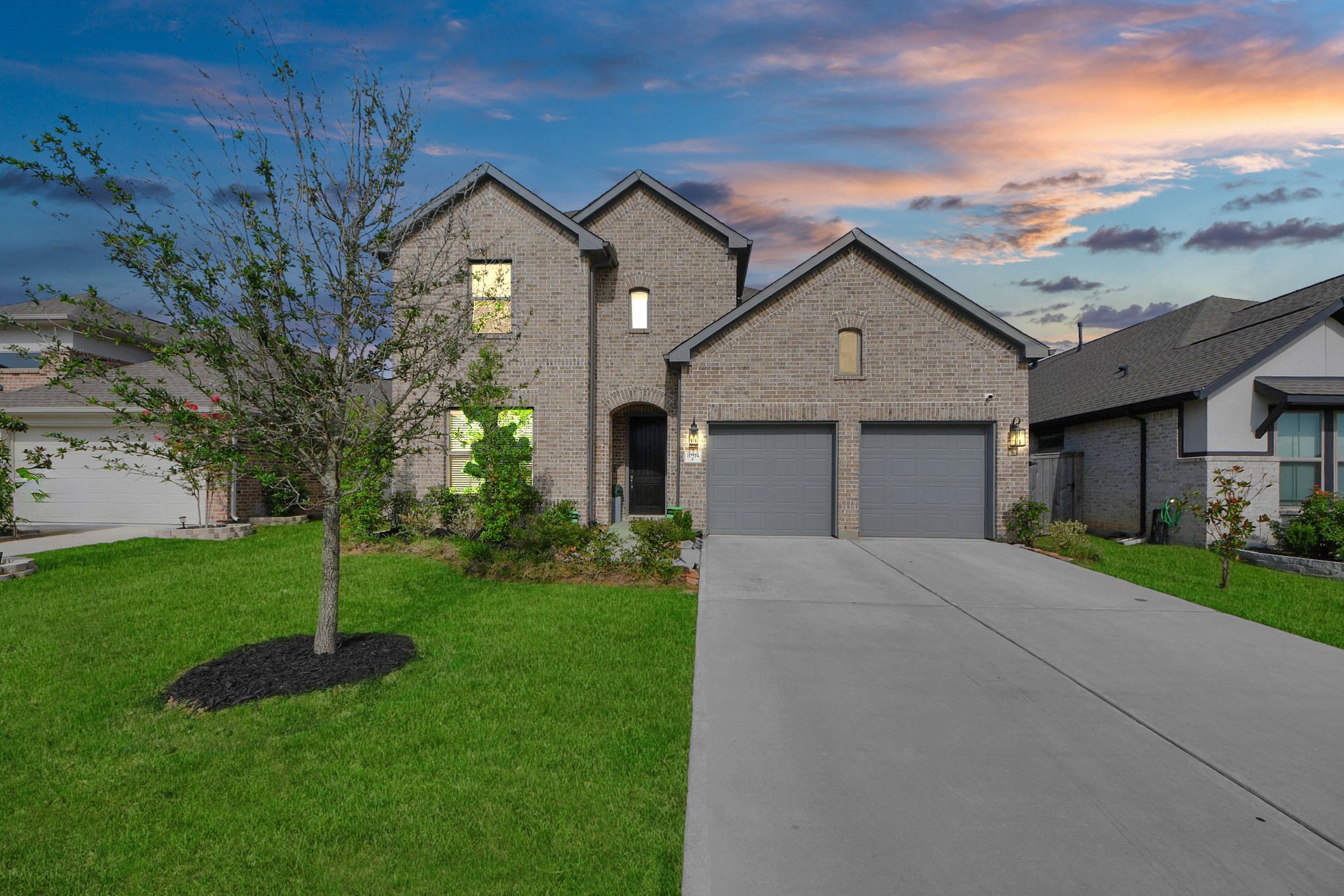10514 Rigel Rdg Way Richmond, TX 77406 - Photo 2 of 50 a front view of a house with a yard and garage
