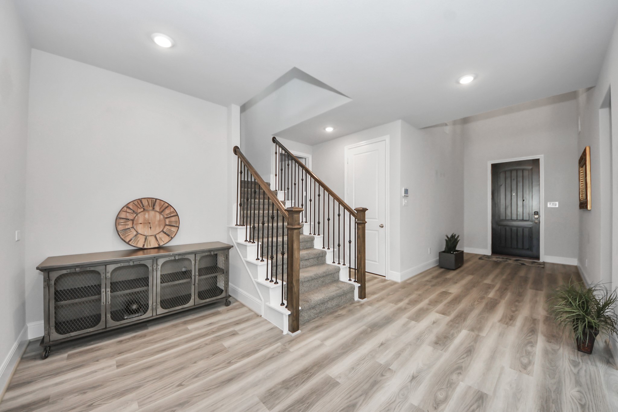 10514 Rigel Rdg Way Richmond, TX 77406 - Photo 30 of 50 a view of a livingroom with wooden floor and stairs