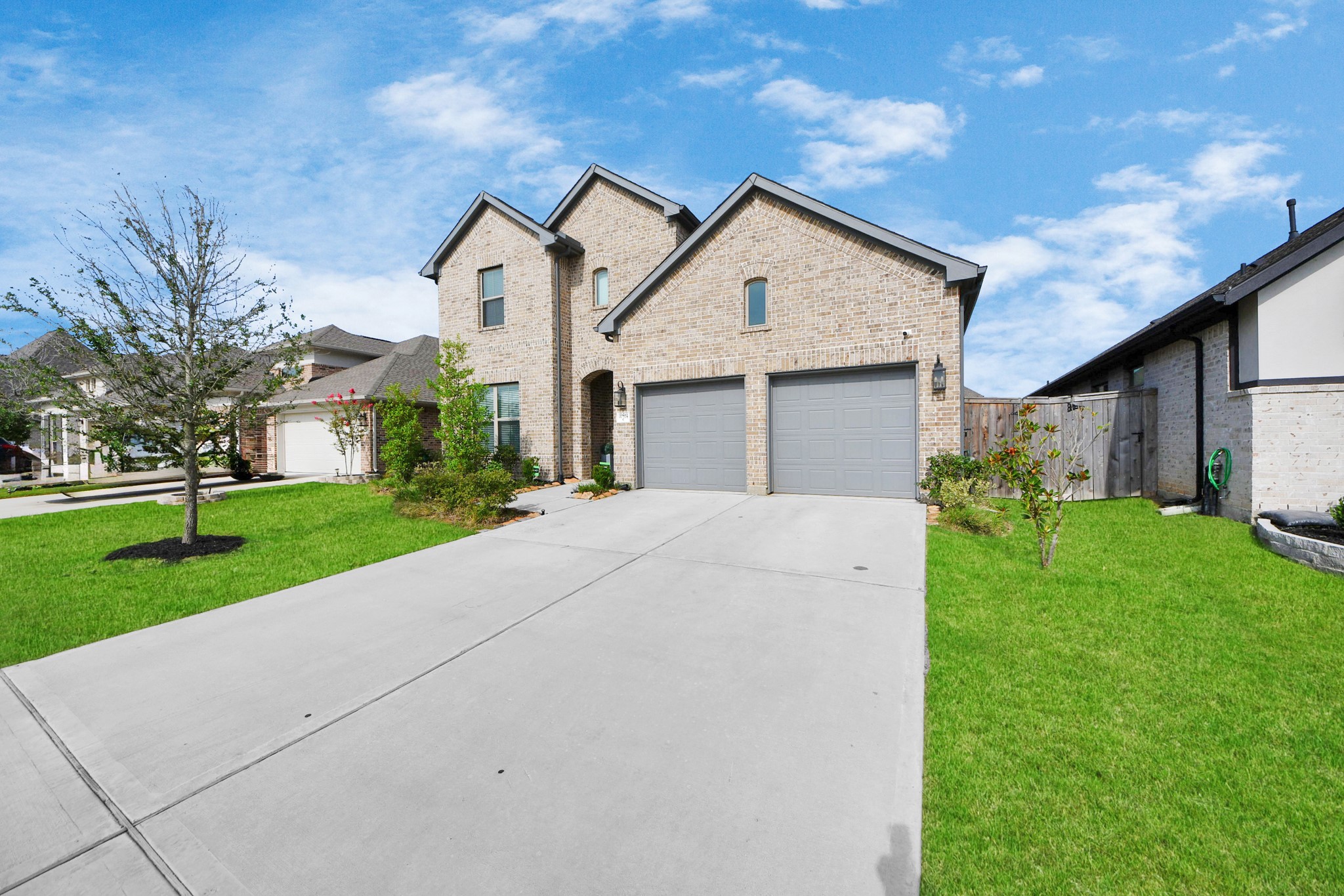 10514 Rigel Rdg Way Richmond, TX 77406 - Photo 47 of 50 a view of a yard in front of a house with plants and large tree