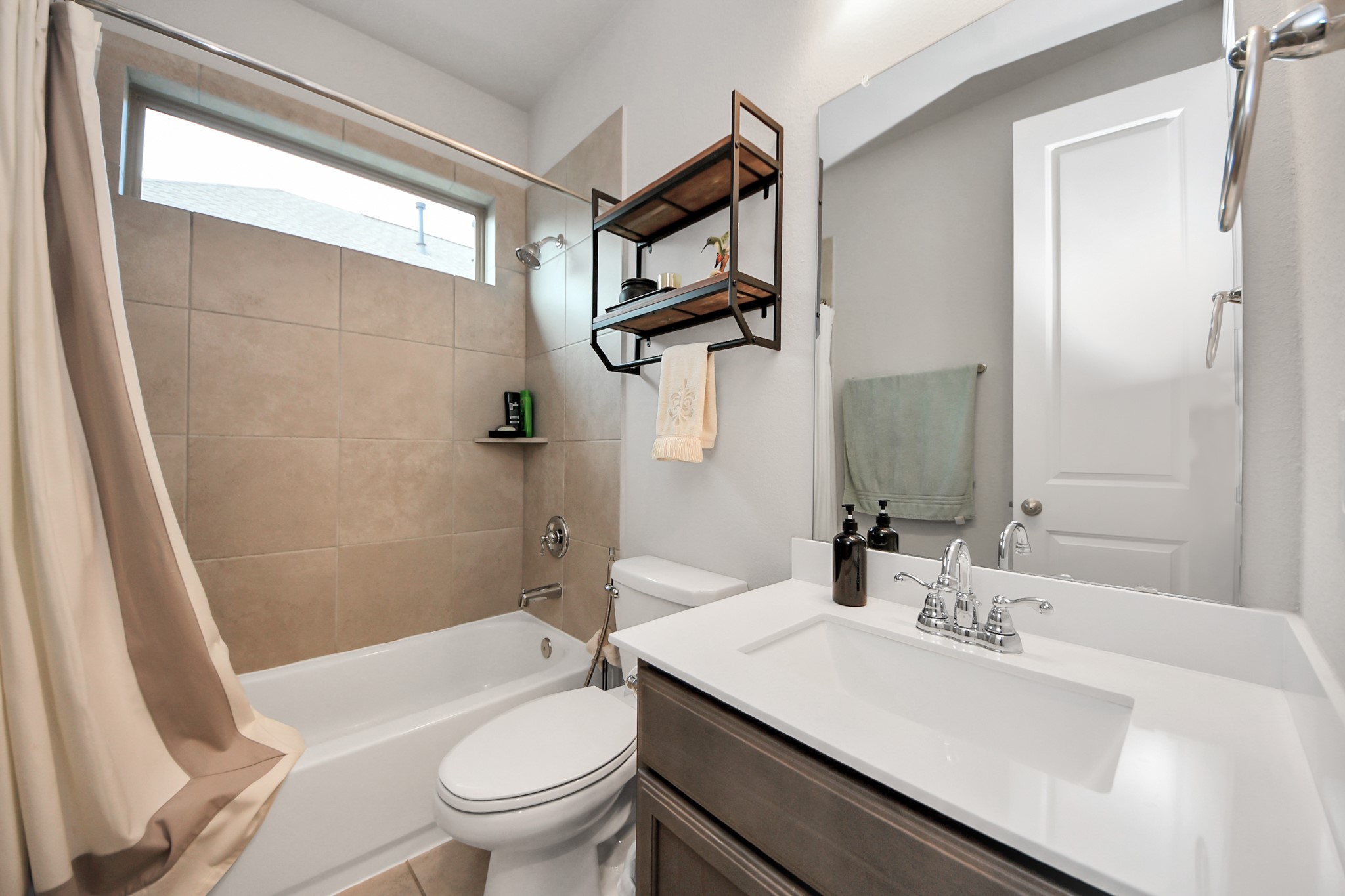 10514 Rigel Rdg Way Richmond, TX 77406 - Photo 8 of 50 a bathroom with a sink a toilet and shower