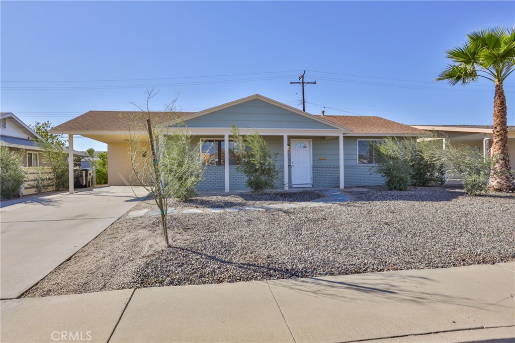28657 Murrieta Road Menifee, CA 92586 - Photo 1 of 1 a front view of a house with garden