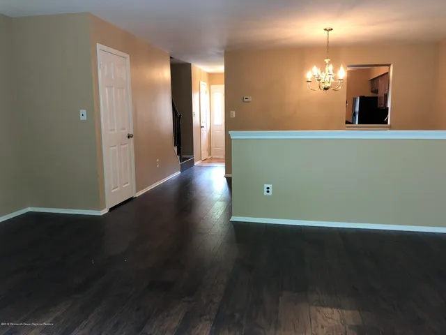 a view of a livingroom with wooden floor