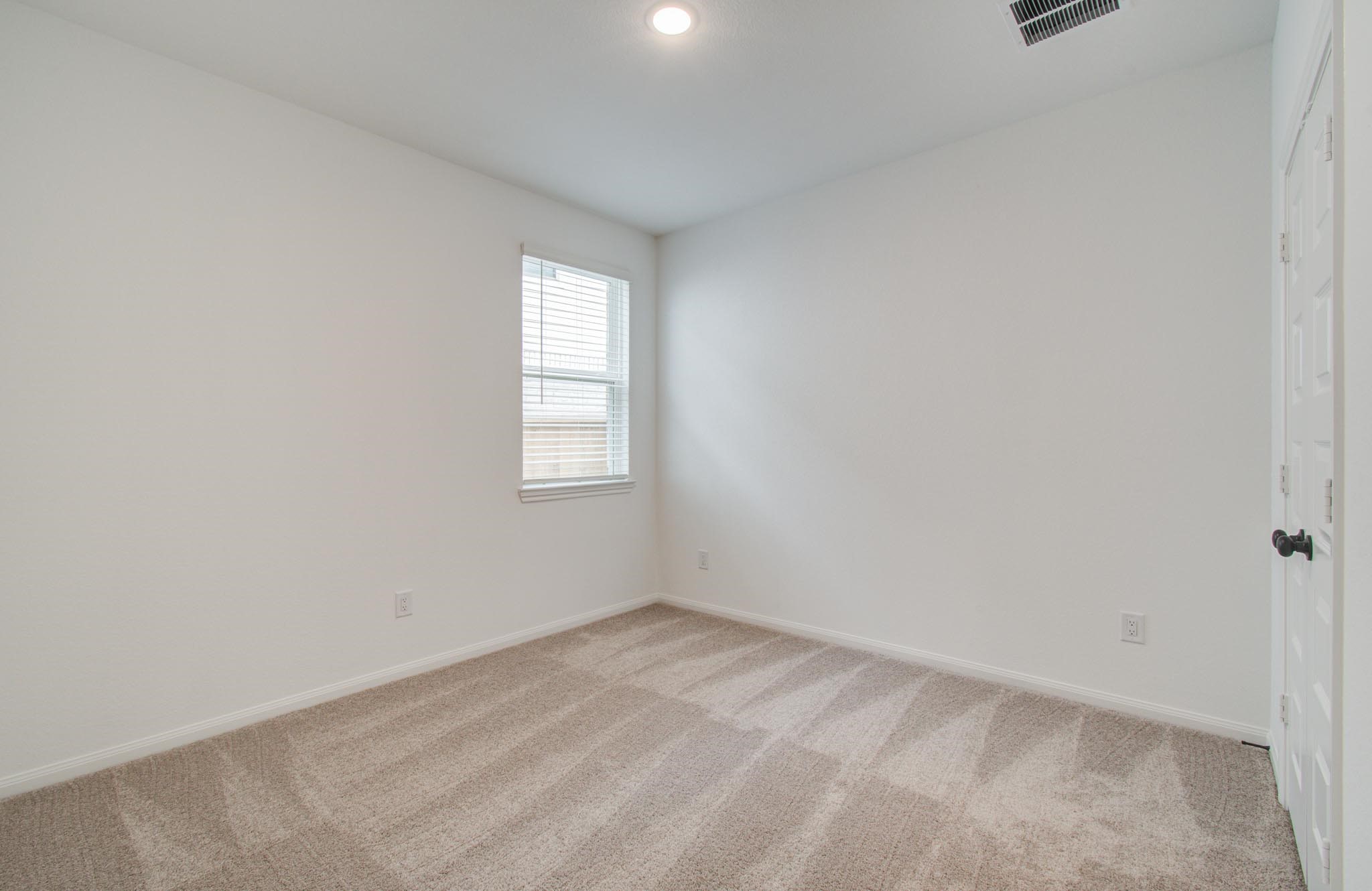 7231 Yarrow Blossom Court Katy, TX 77493 - Photo 22 of 49 an empty room with windows