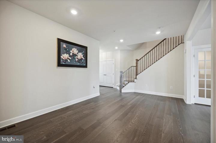 325 Piper Lane Exton, PA 19341 - Photo 4 of 24 a view of an empty room with wooden floor and stairs