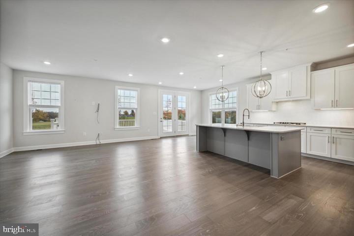 325 Piper Lane Exton, PA 19341 - Photo 10 of 24 a large kitchen with stainless steel appliances granite countertop a large counter top a wooden floors and a large window