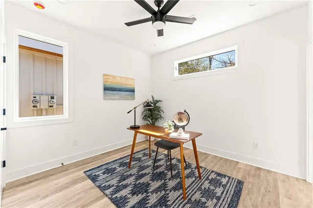 a bathroom with a sink mirror vanity and toilet