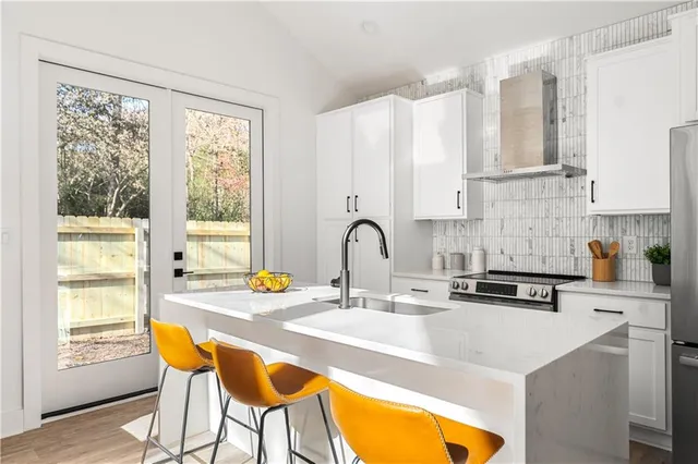 a view of a kitchen with dining table and chairs