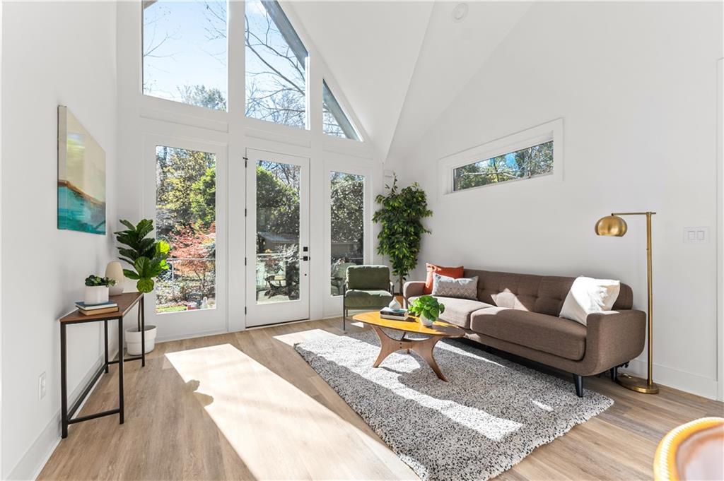 845 Ormewood Terrace Southeast, Unit C Atlanta, GA 30316 - Photo 19 of 37 a living room with furniture and a potted plant