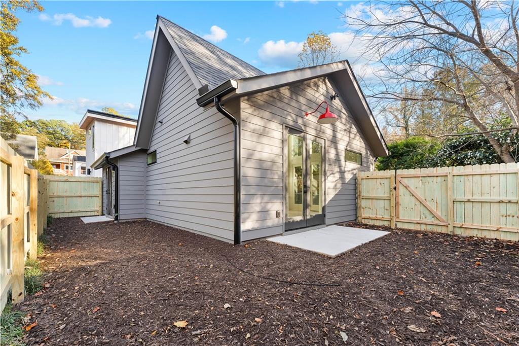 845 Ormewood Terrace Southeast, Unit C Atlanta, GA 30316 - Photo 24 of 37 a view of a house with a small yard and wooden fence