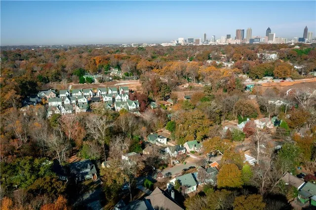 an aerial view of a house with a yard and garden