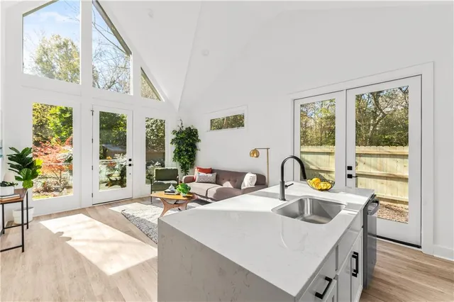 a kitchen with a sink and a large window