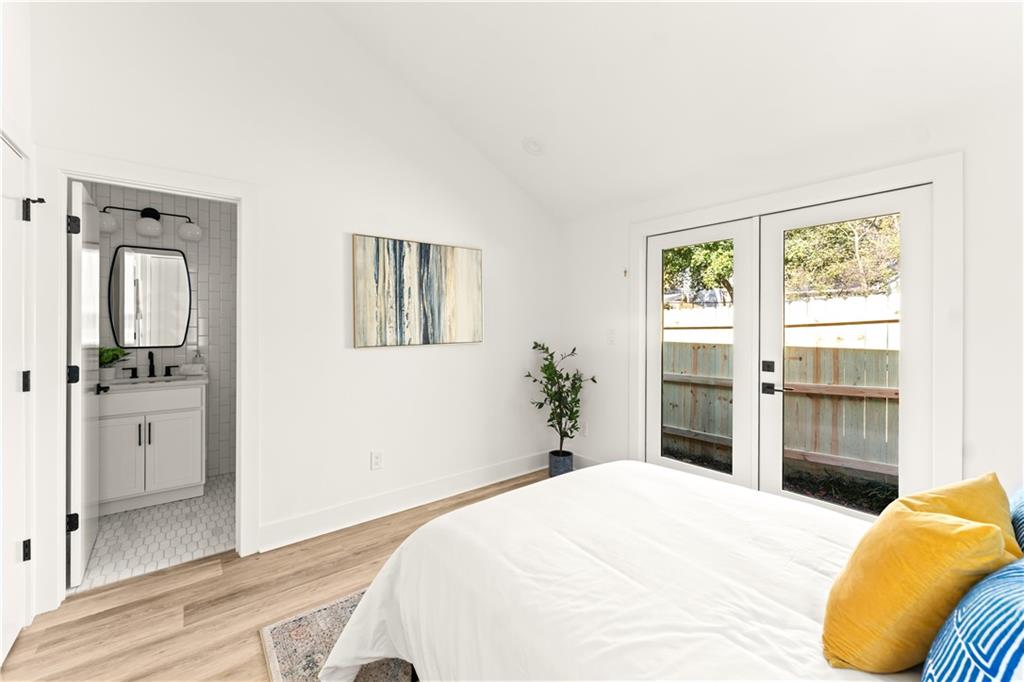 845 Ormewood Terrace Southeast, Unit C Atlanta, GA 30316 - Photo 7 of 37 a bedroom with a bed and a dresser