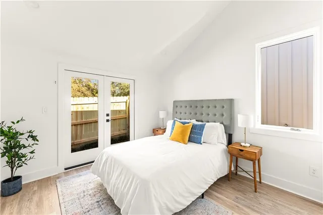a bathroom with a sink vanity mirror and toilet