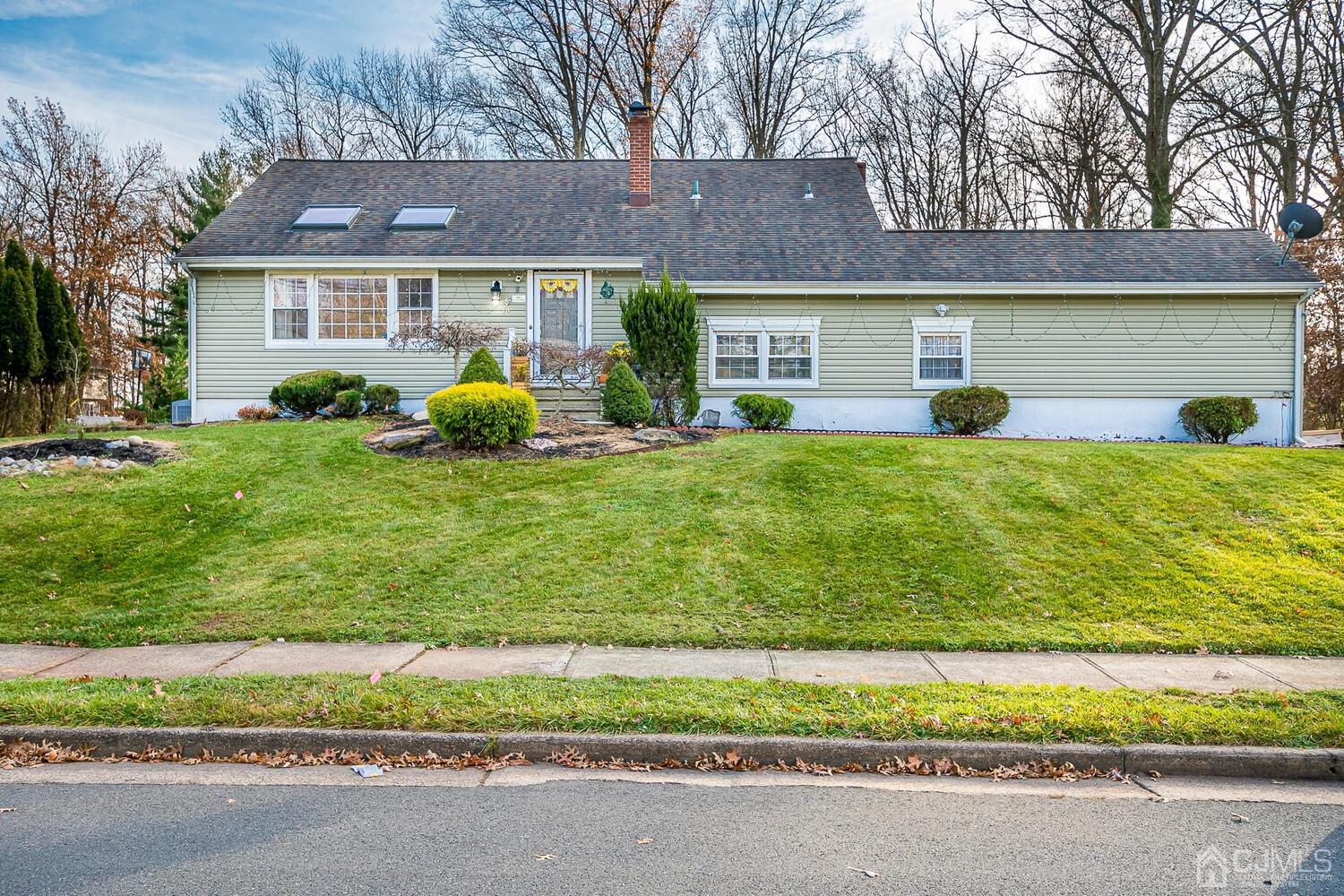 14 Midland Road Edison, NJ 08820 - Photo 1 of 32 a front view of a house with a yard and garage