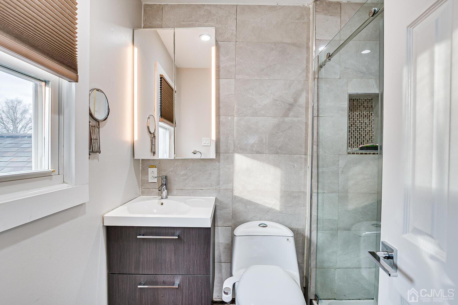 14 Midland Road Edison, NJ 08820 - Photo 22 of 32 a bathroom with a sink toilet and shower